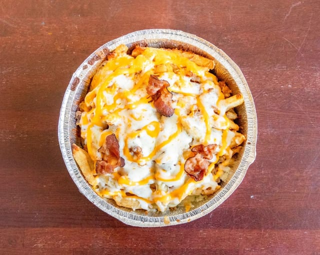 Sexy Fries lots of Queso & Bacon.